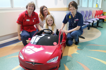 Children’s unit goes electric as tiny Tesla drives into Poole Hospital 